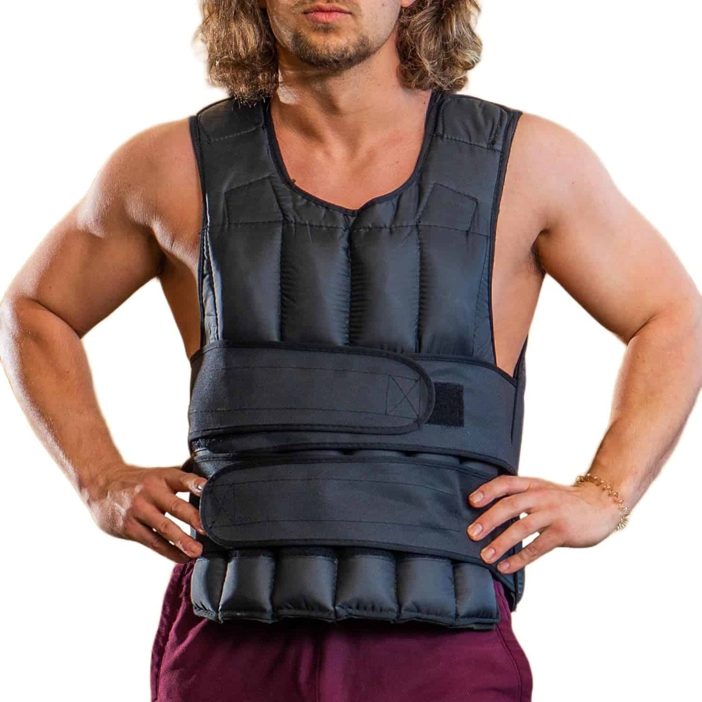 Man wearing a black weighted vest on a white background