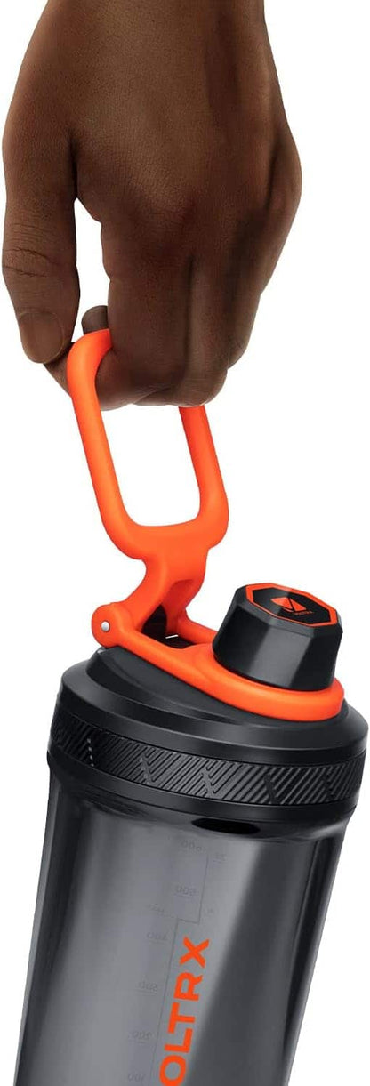 Black and orange water bottle with carabiner handle held by a hand