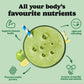 Green smoothie with a straw on a light green background, promoting health benefits.