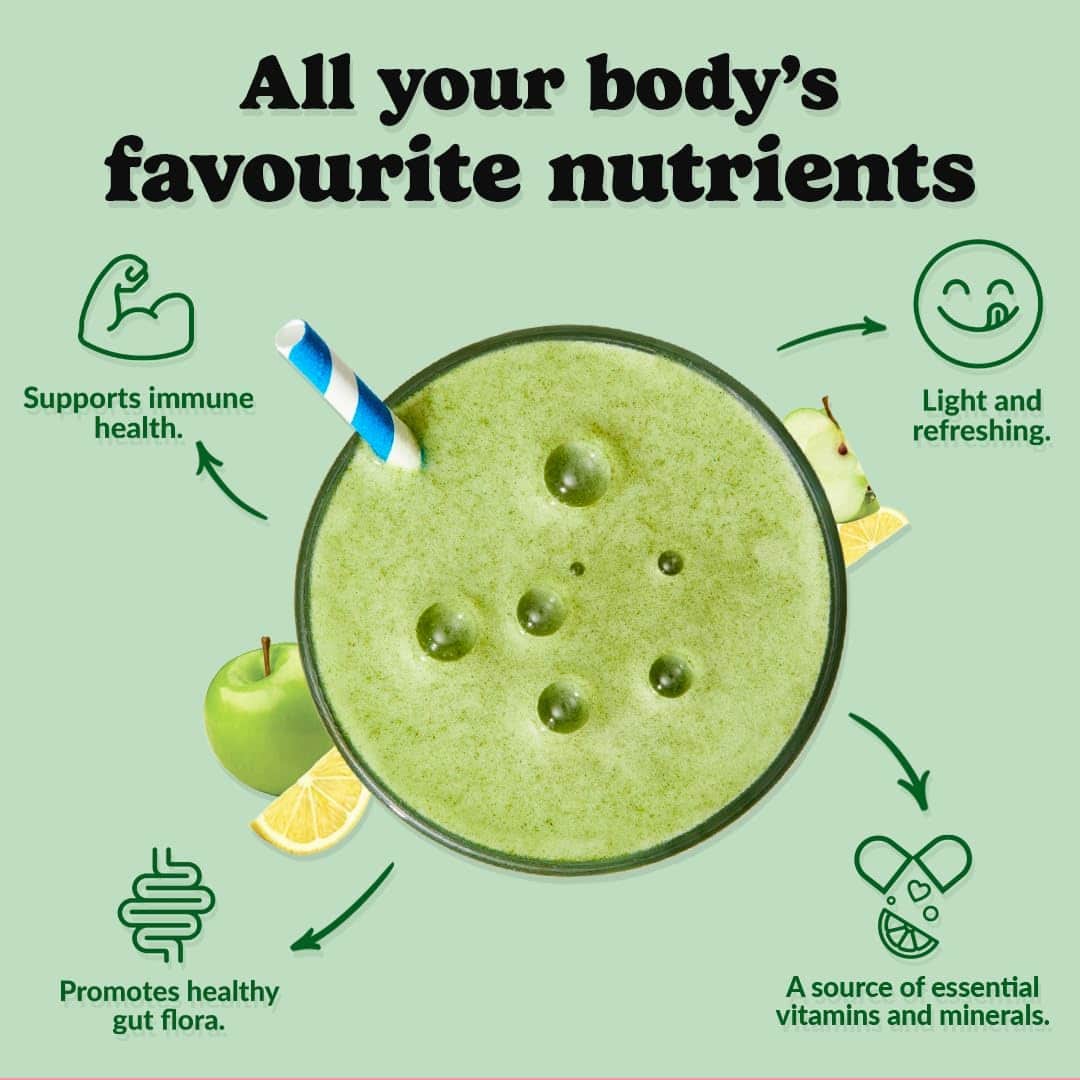 Green smoothie with a straw on a light green background, promoting health benefits.