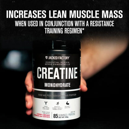 Hand holding a creatine monohydrate supplement container with promotional text on a dark background