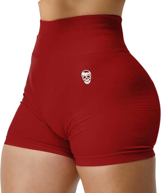 Red athletic shorts with a small white logo on a white background