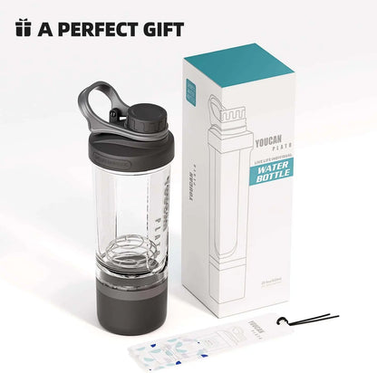 Clear water bottle with black lid and base next to its packaging on a white background
