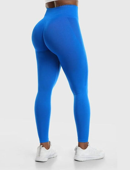 Blue leggings worn by a person on a white background