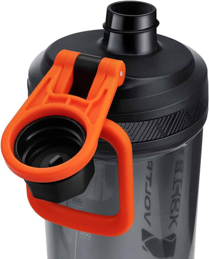 Black and gray shaker bottle with orange handle on a white background