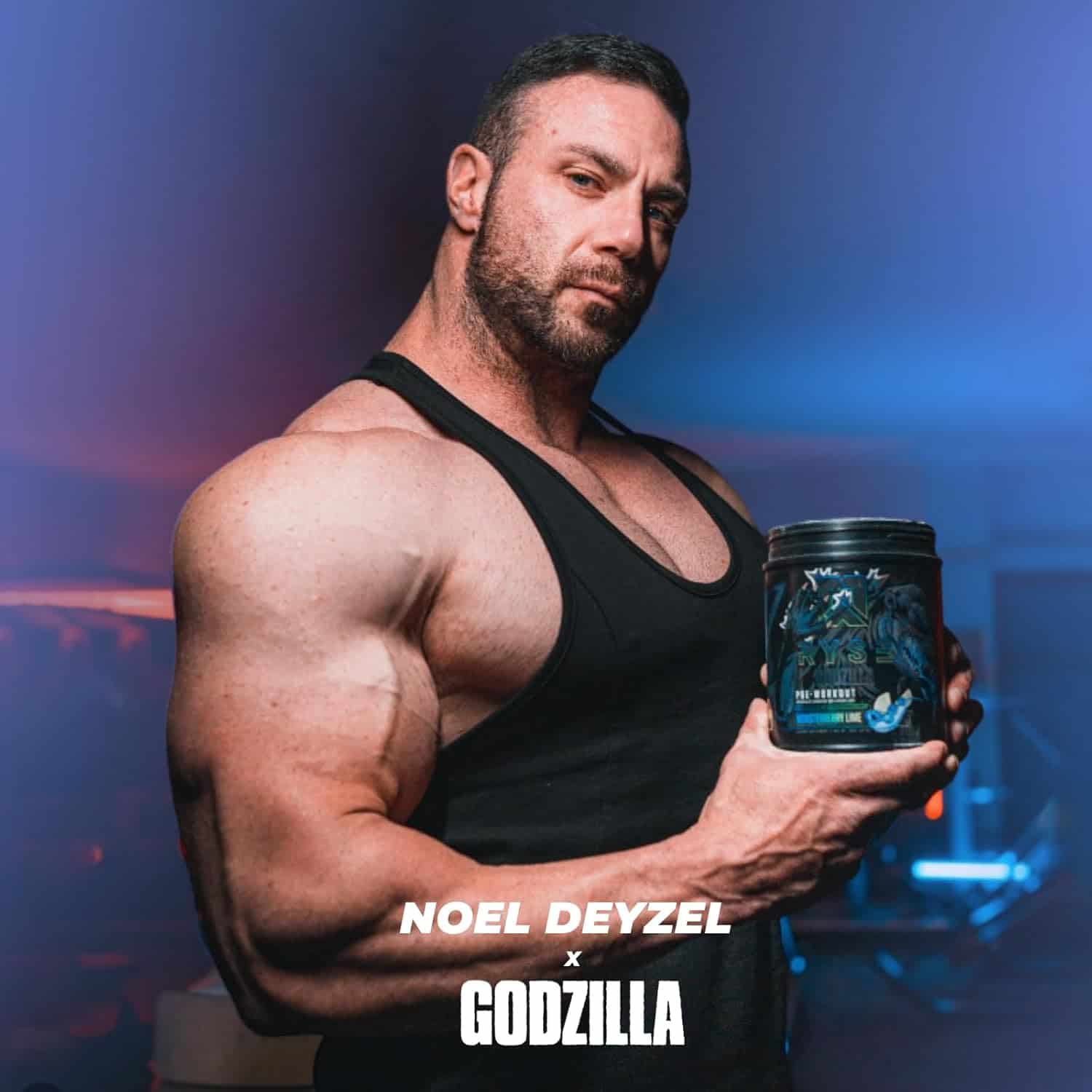Muscular man holding a supplement container with 'Noel Deyzel x Godzilla' branding.