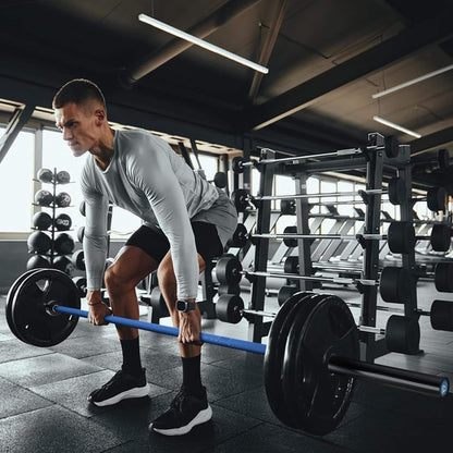 Man lifting a barbell in a gym setting