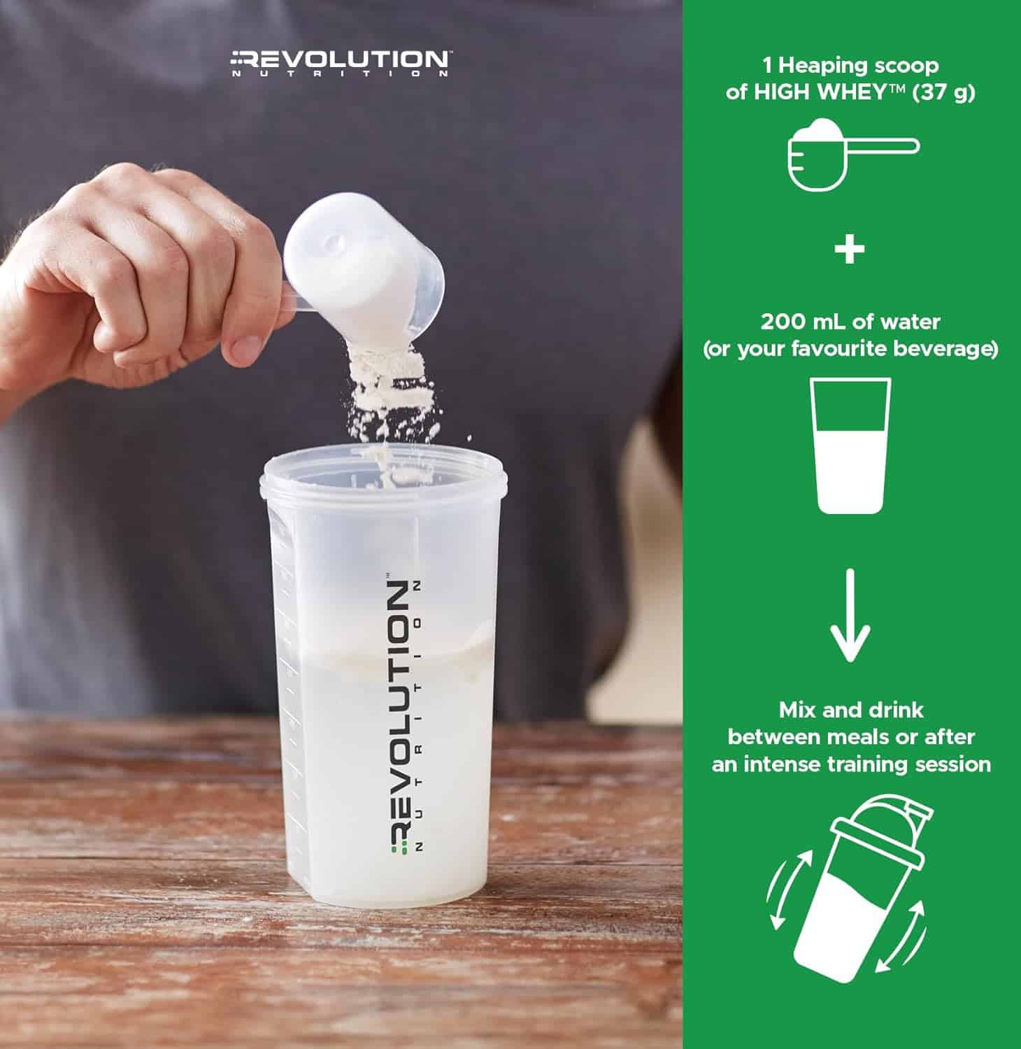 Person pouring a scoop of Revolution Nutrition protein powder into a shaker.