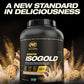 ISOGOLD protein powder container with cookies in the background and text 'A New Standard in Deliciousness' on a black background.