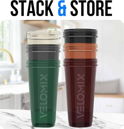 Two tumblers, one green and one brown, with 'VeloMix' branding on a marble surface.