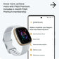 Fitbit smartwatch with smartphone displaying Fitbit Premium app on a white background