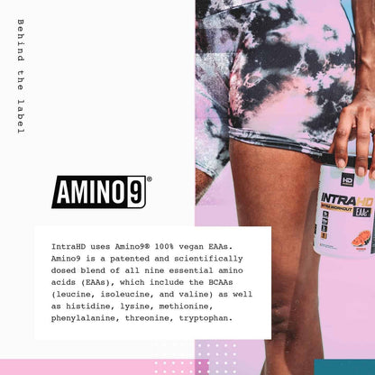 Person holding a supplement bottle with Amino9 branding and product details.