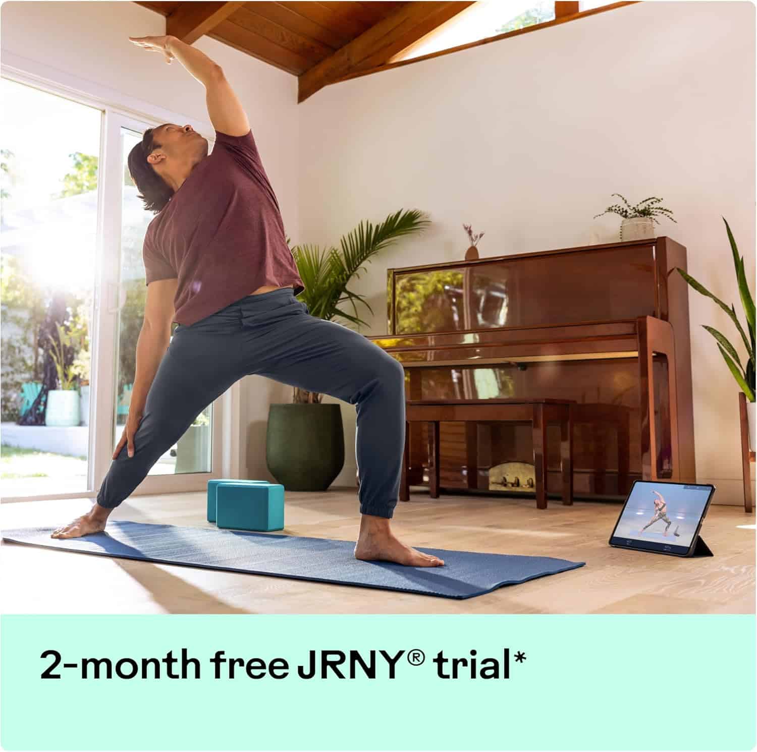 Person practicing yoga in a home setting with a piano and plants.