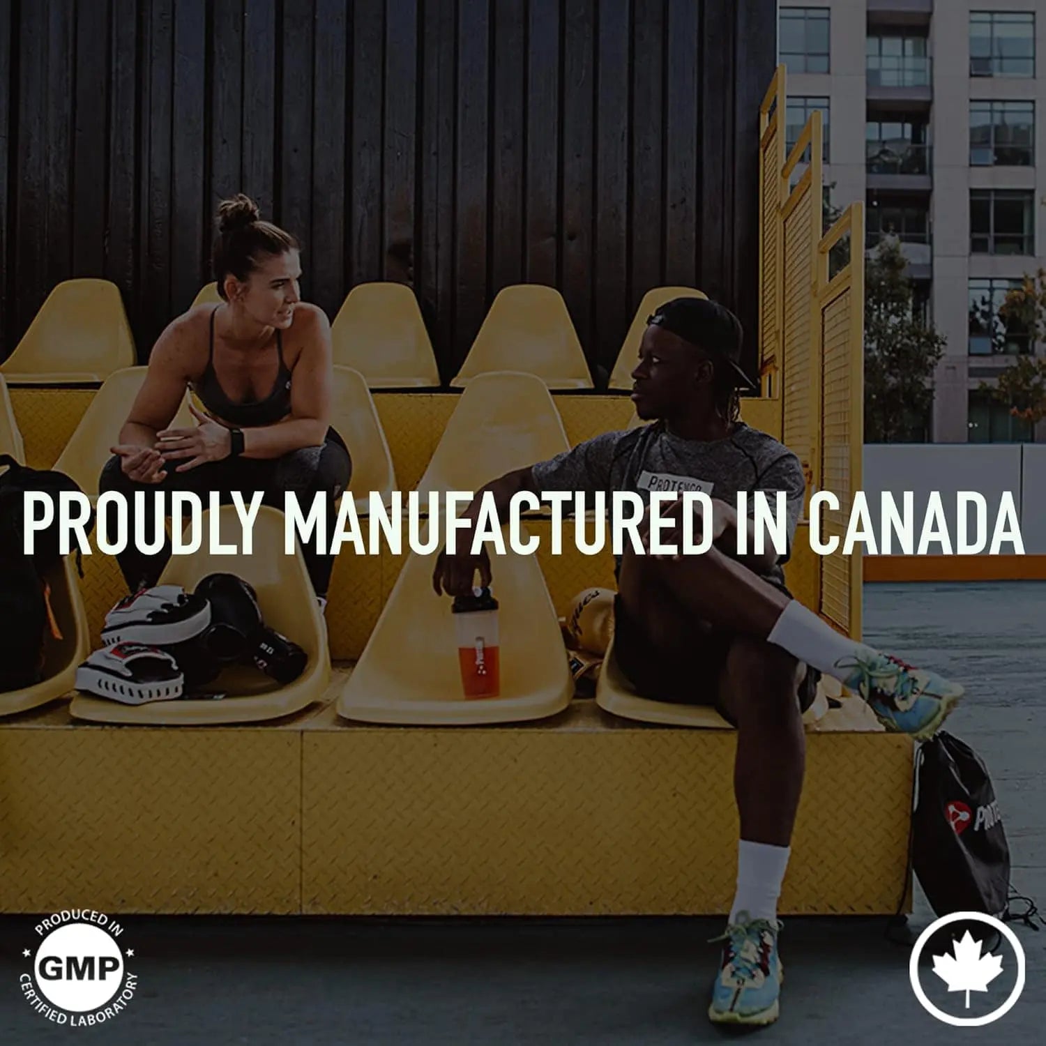 Two people sitting on yellow chairs with text 'Proudly Manufactured in Canada' and logos.