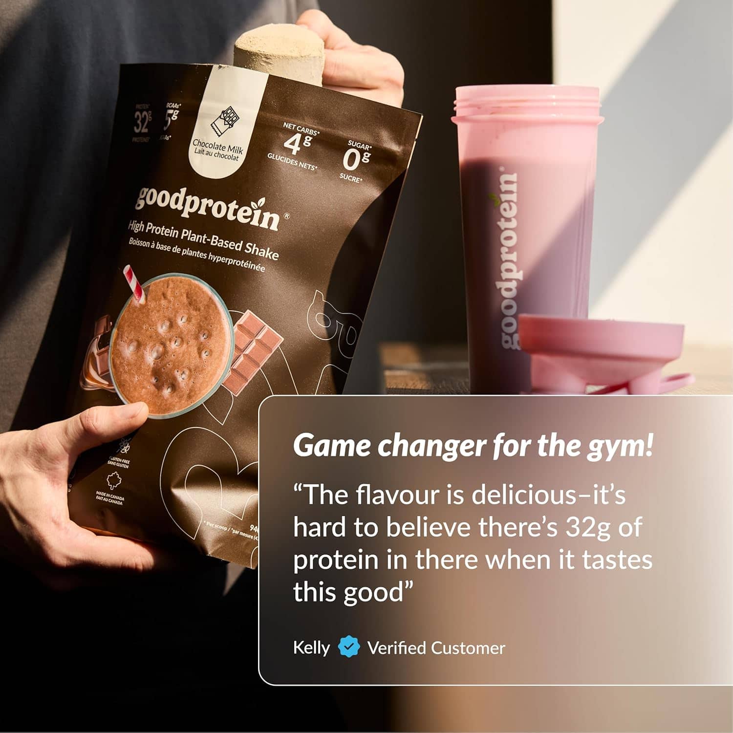 Goodprotein shake package held by a person with a testimonial quote on a gray background