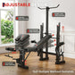 Multifunctional gym bench with adjustable components in a home setting