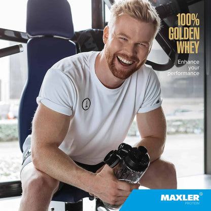 Man holding a shaker bottle in a gym setting with 'Maxler' branding.