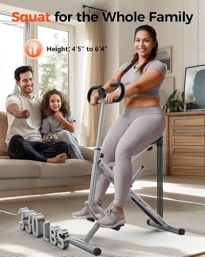 Woman using a home exercise bike with a family in the background