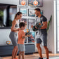 Family exercising together with fitness equipment in a home setting