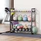 Fitness equipment including kettlebells, weights, and exercise balls on a metal rack in a home gym.