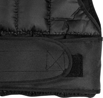 Close-up of a black quilted vest with a patch on a white background