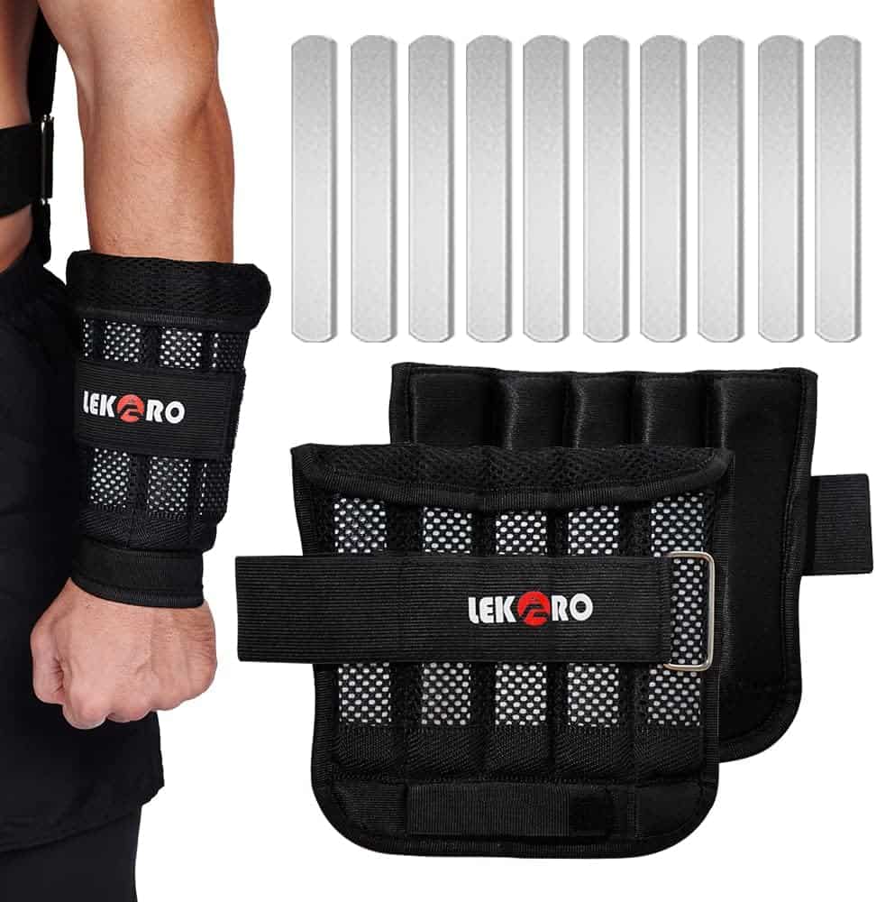 Black weightlifting straps with adjustable straps and weight plates on a white background
