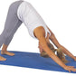 Person performing a yoga pose on a blue mat with a white background