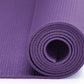 Purple yoga mat rolled up on a white background