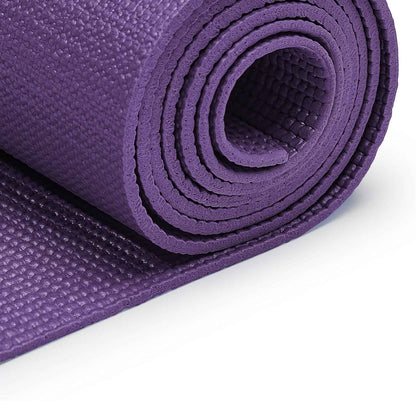Purple yoga mat rolled up on a white background