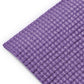 Close-up of a textured purple mat on a white background