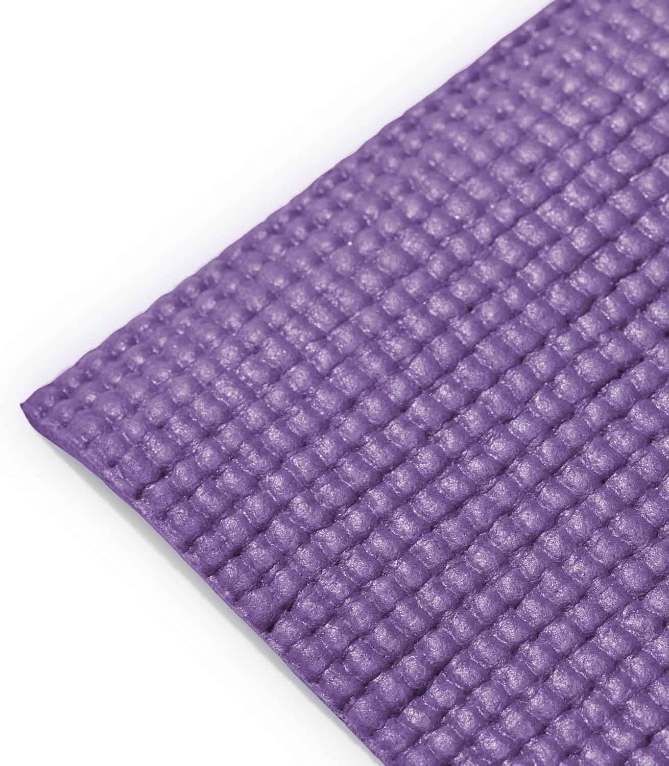Close-up of a textured purple mat on a white background