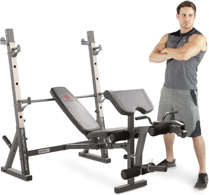 Man standing next to a weight bench and weight rack on a white background
