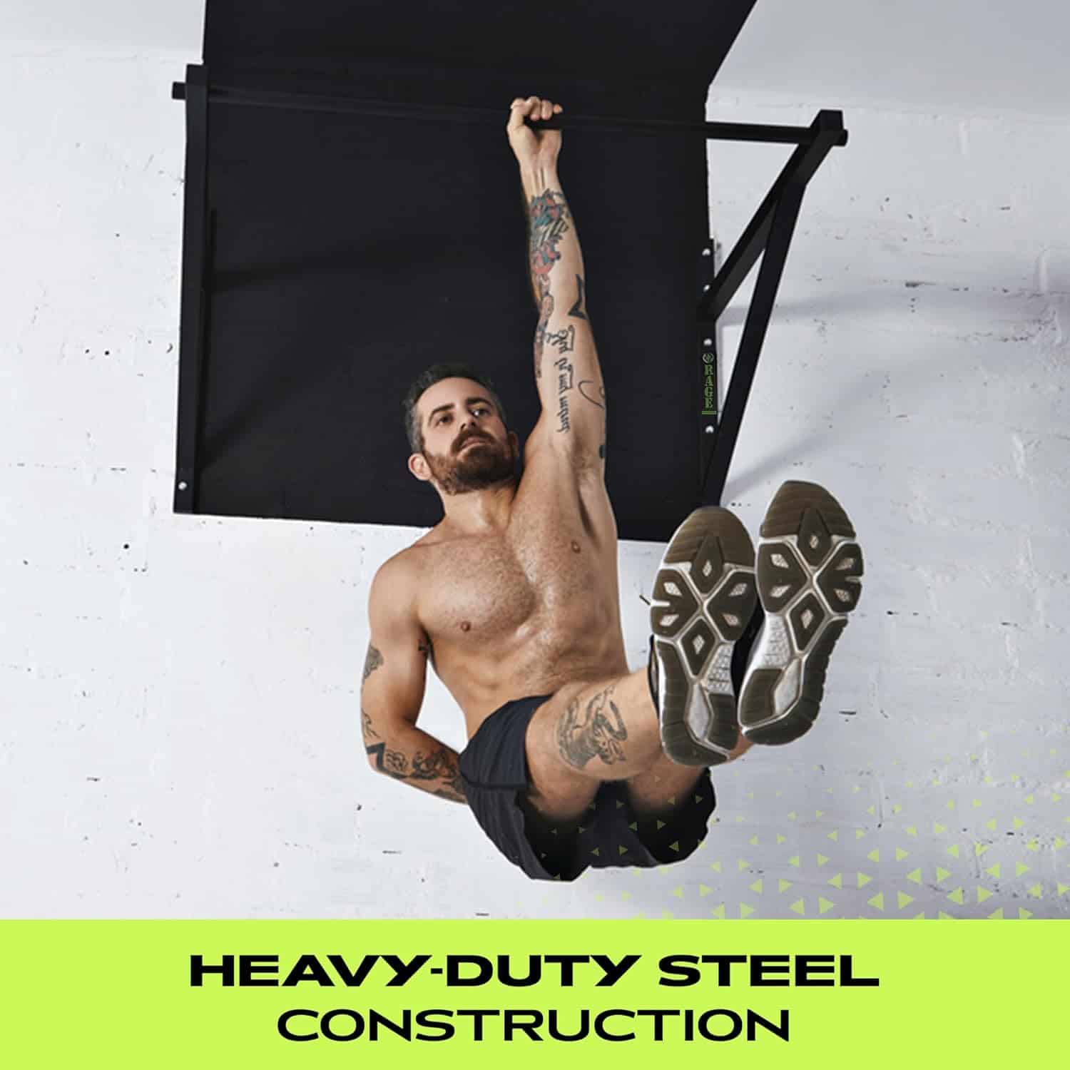 Man performing pull-ups on a heavy-duty steel pull-up bar against a white wall.