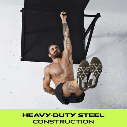 Man performing pull-ups on a heavy-duty steel pull-up bar against a white wall.