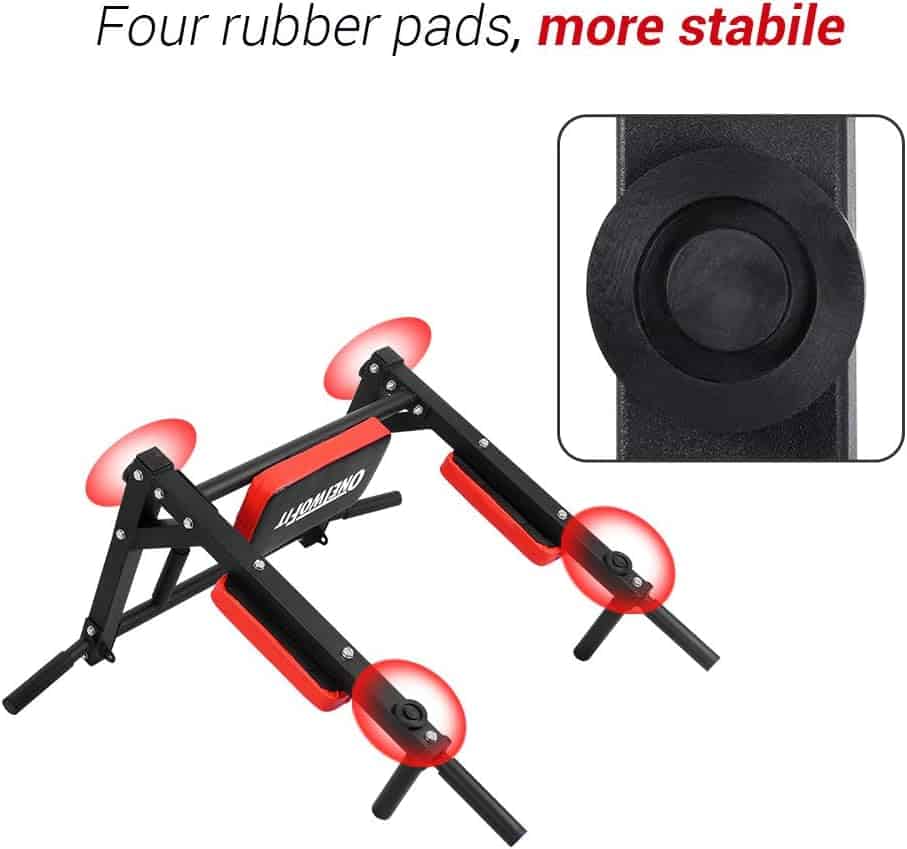 Black and red exercise machine with four rubber pads for stability, showing a close-up of a pad.