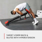 Person using a hyperextension bench for lower back and glutes exercise in a gym setting.