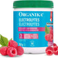 Organika electrolytes supplement container with raspberries on a white background