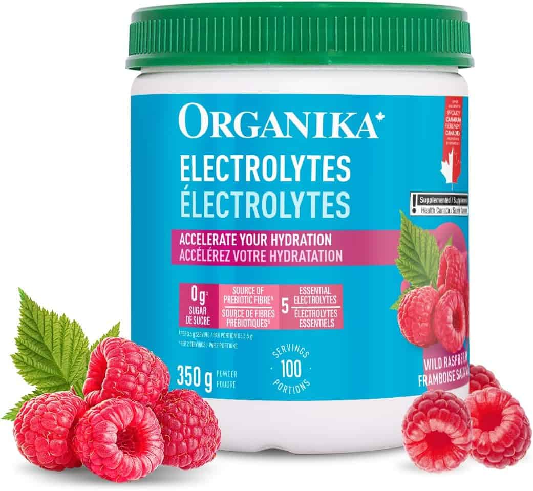 Organika electrolytes supplement container with raspberries on a white background
