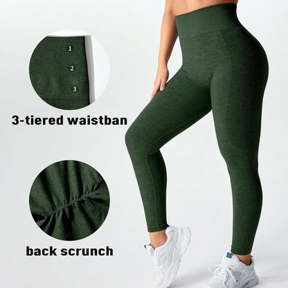 Green leggings with a focus on the waistband and back scrunch design, worn by a person.
