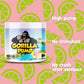 Gorilla Pump supplement container with a pink lemonade flavor on a pink background with lime slices.