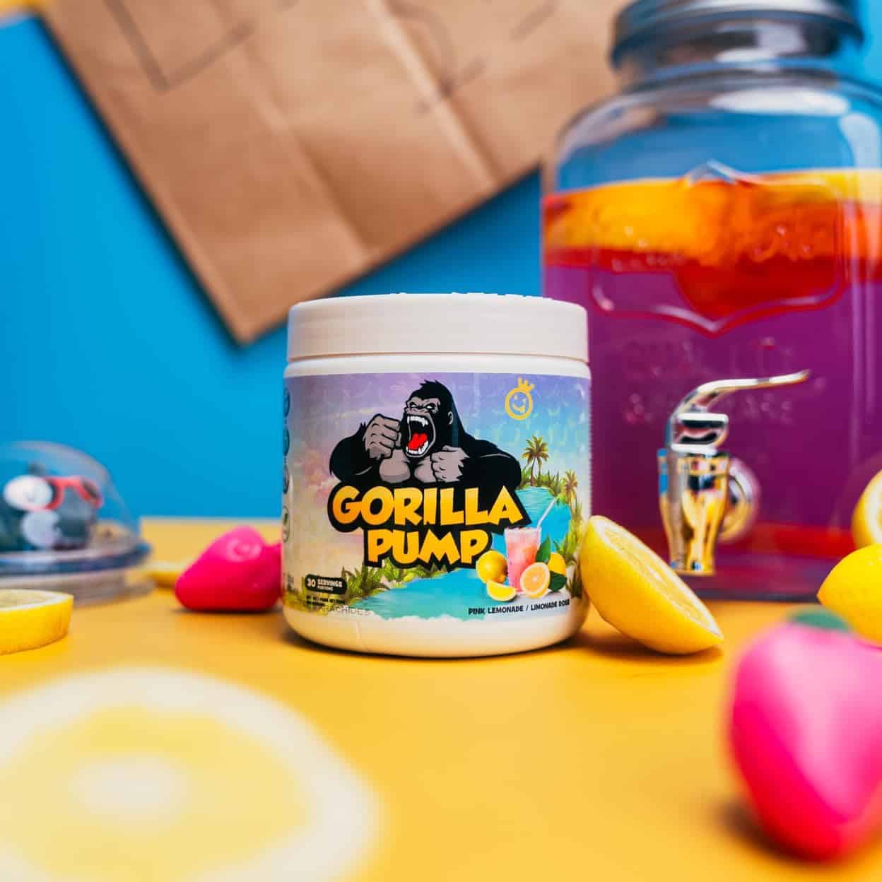 Gorilla Pump container on a colorful background with a jar of fruit punch.