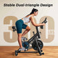 Woman exercising on a stationary bike with 'Stable Dual-triangle Design' and '300 lbs' text in the background.