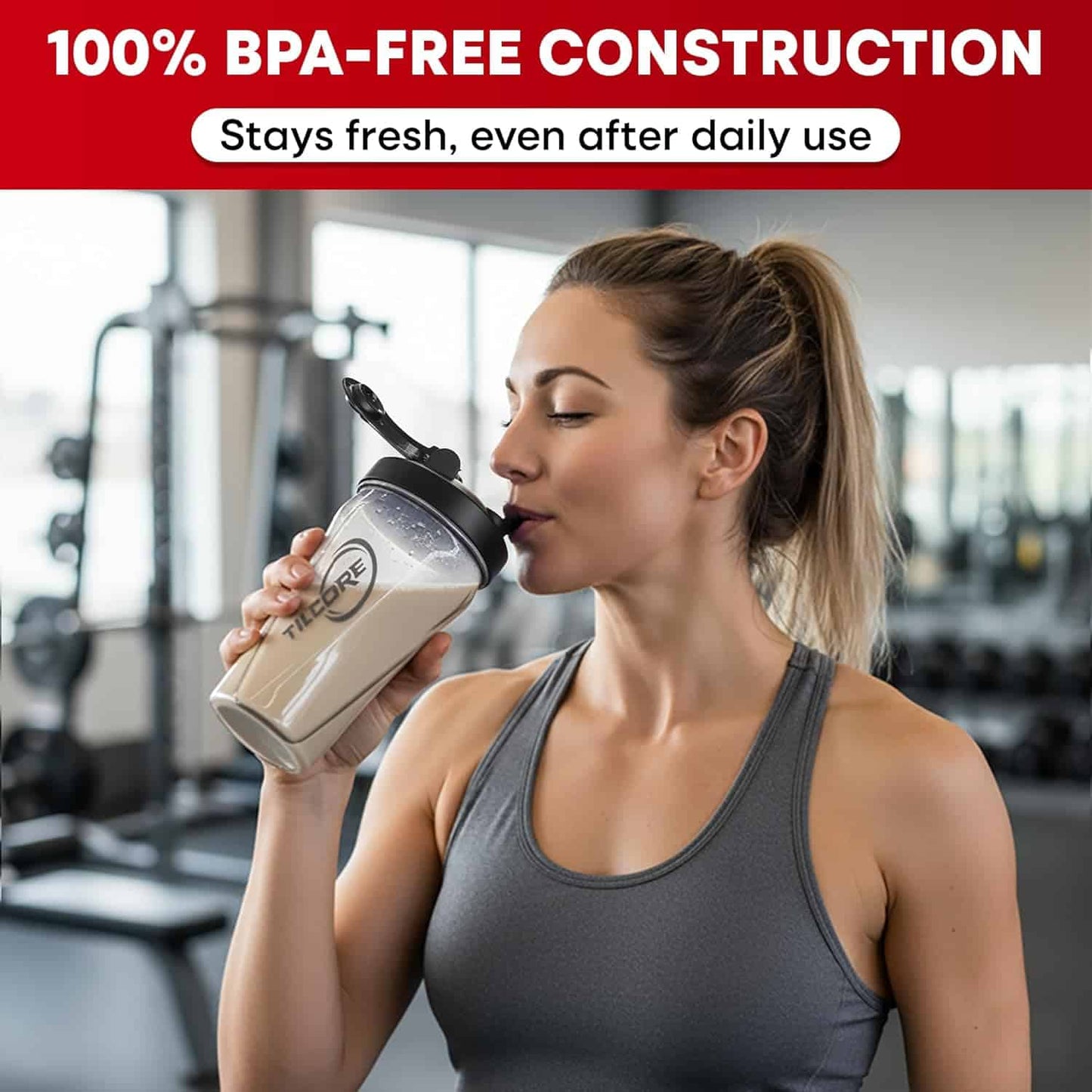 Woman drinking from a BPA-free container in a gym setting