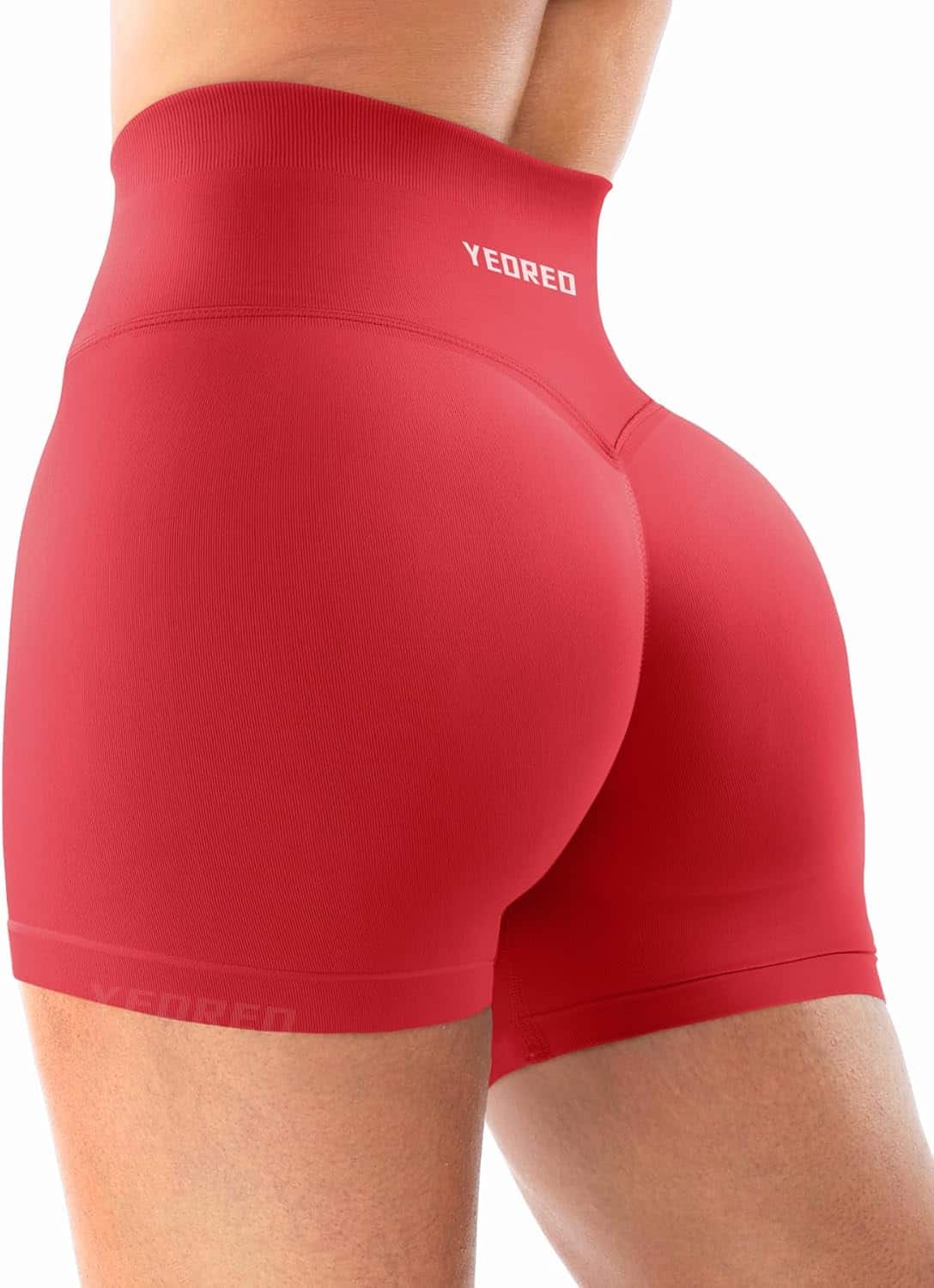 Red athletic shorts with 'YEORED' branding on a white background