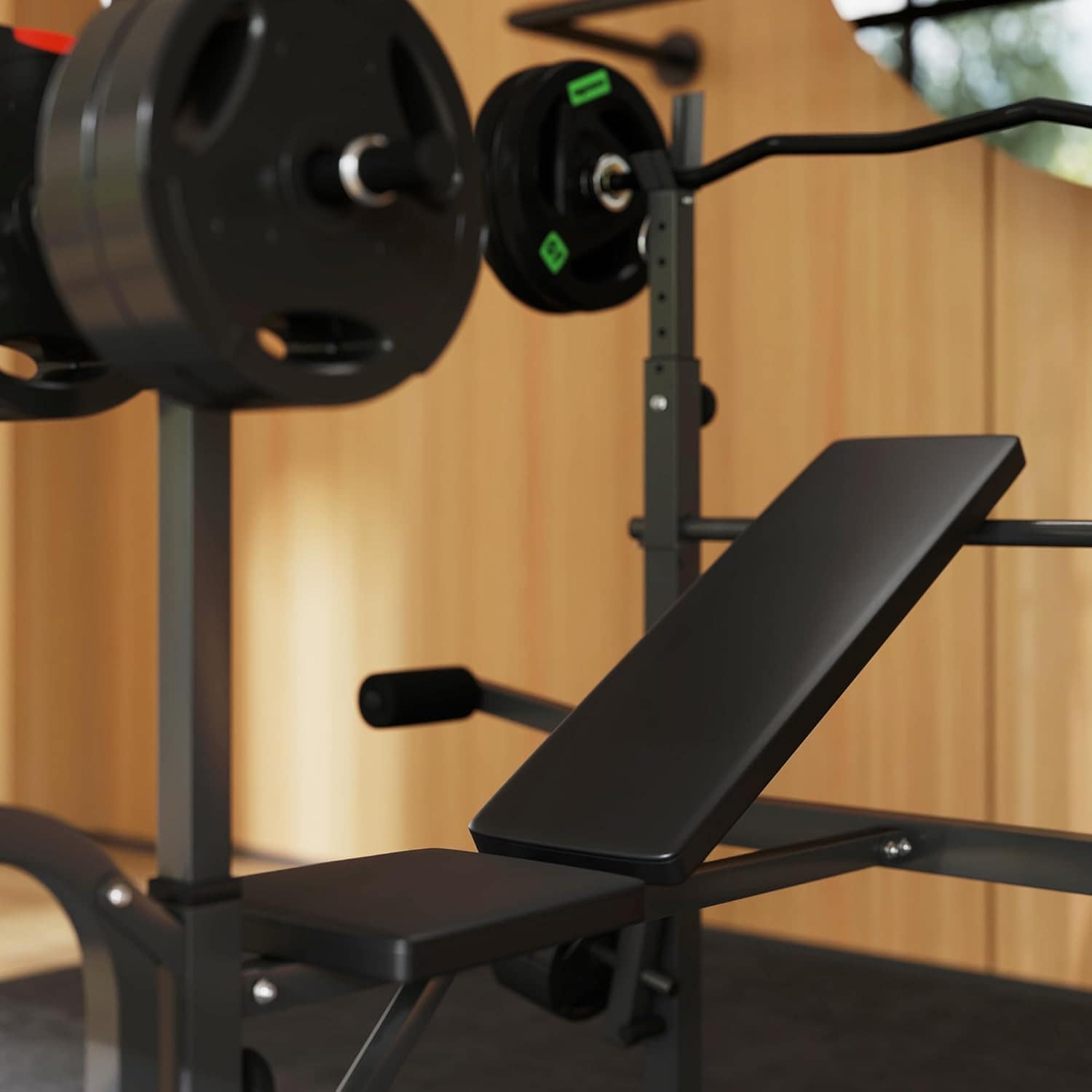 Black weight bench with barbell on a wooden background.