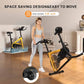 Woman standing next to a space-saving exercise bike in a living room.