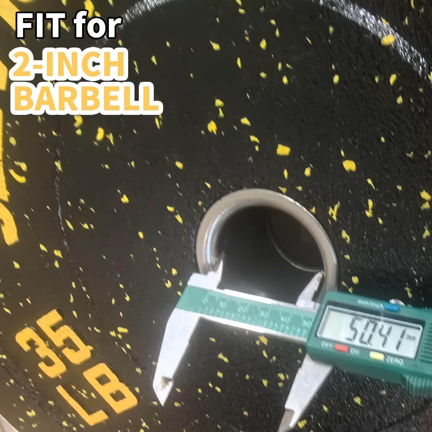 Digital caliper measuring a 2-inch barbell on a black surface with yellow text.